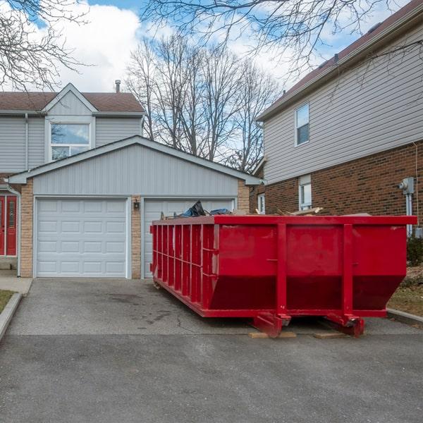 large construction dumpster with heavy equipment